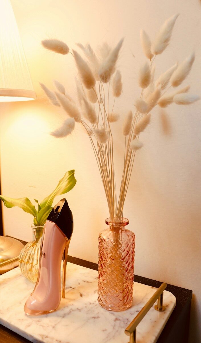 Pink high heel perfume bottle with dried flowers