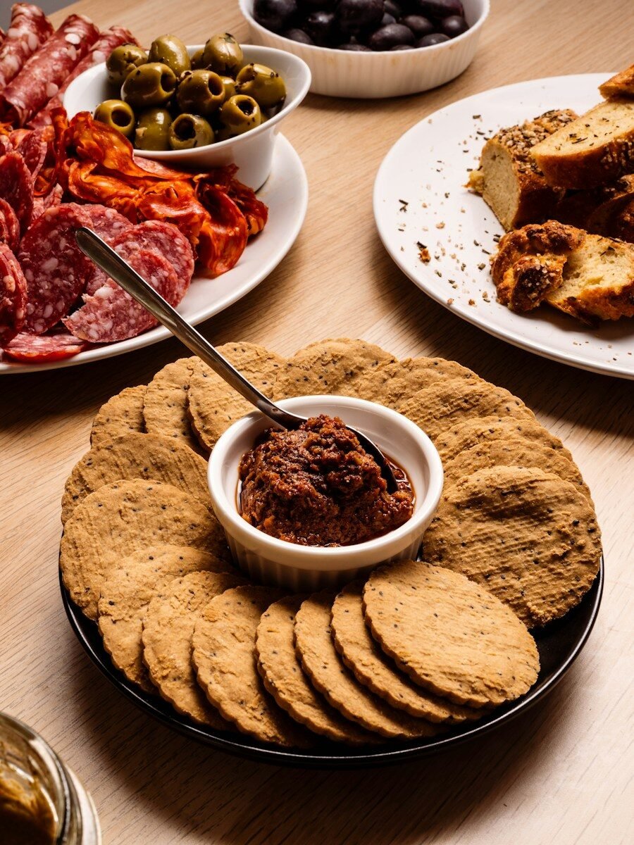 Crackers and dip with charcuterie board